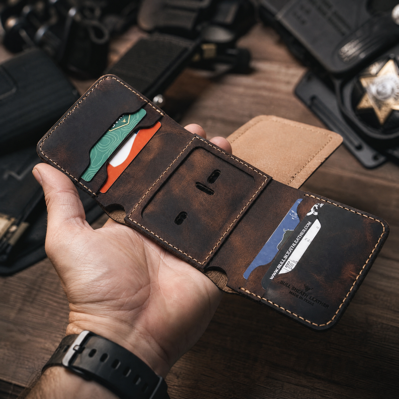 Officer hand presenting badge trifold — Bull Sheath Leather