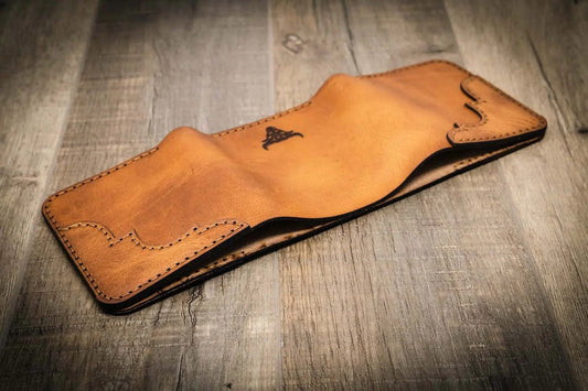 Trinity western trifold wallet in saddle tan leather, featuring intricate stitching and a smooth finish, handmade in the USA by Bull Sheath Leather.