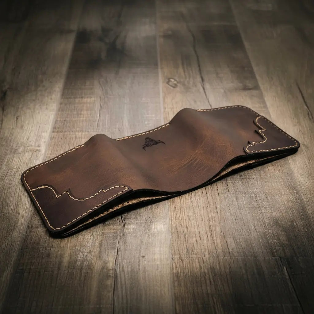 Trinity western trifold wallet in walnut brown leather, featuring intricate stitching and a smooth finish, handmade in the USA.
