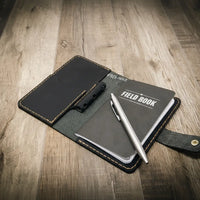 field notebook, black leather journal cover
