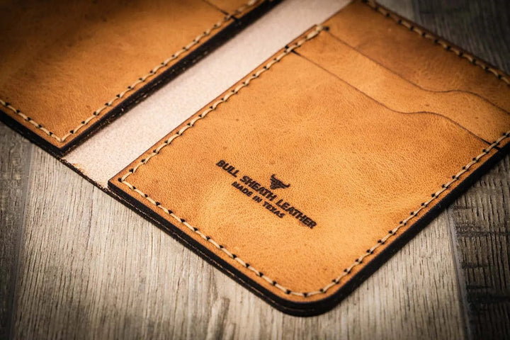 Handmade saddle tan leather wallet, in a vertical design, Bull Sheath Leather branding.
