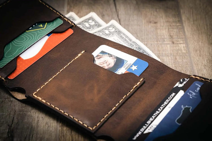Trinity western trifold wallet in walnut brown leather, featuring multiple card slots and a cash compartment, handmade in the USA by Bull Sheath Leather.