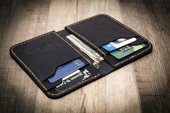 Handmade black leather western vertical wallet with card slots and cash pocket.