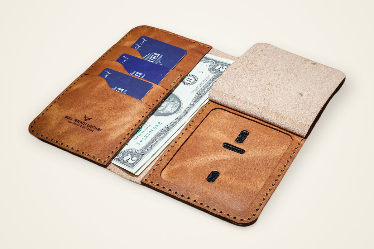 Badge Long Wallet on a cream background, showing its dedicated badge slot, six-plus card slots, two full-length cash pockets, horween full-grain leather