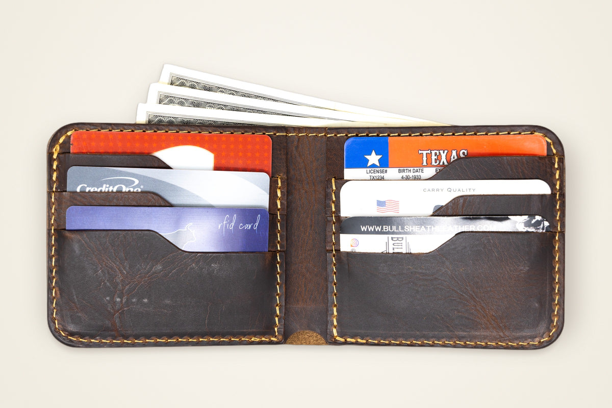 Big Bend Bifold Wallet on a cream background, showing its eight card slots, hidden vertical pockets, full-width cash pocket, handmade in mansfield, texas
