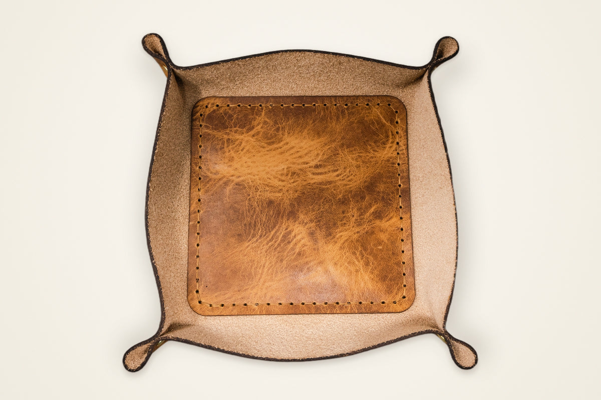 Valet Tray on a cream background, showing its 6" x 6" interior, sides that hold their shape, full-grain horween leather