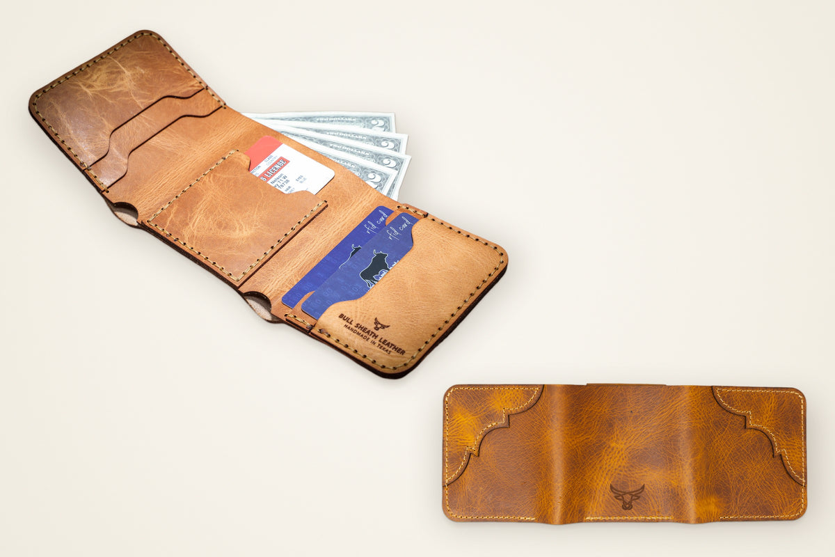 Western Trifold Wallet on a cream background, showing its five card slots, full-width cash pocket, full-grain horween leather, western tooling, applied by hand