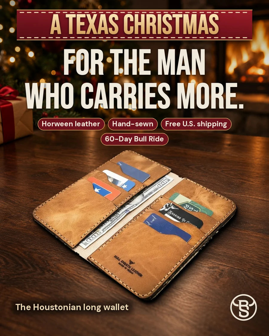 For the man who carries more. The open Houstonian long wallet in Saddle Tan by a Christmas fireplace