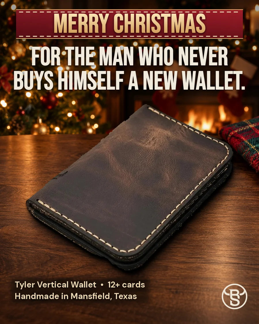 For the man who never buys himself a new wallet. The Tyler Vertical Wallet in Walnut Brown, closed, by the Christmas tree
